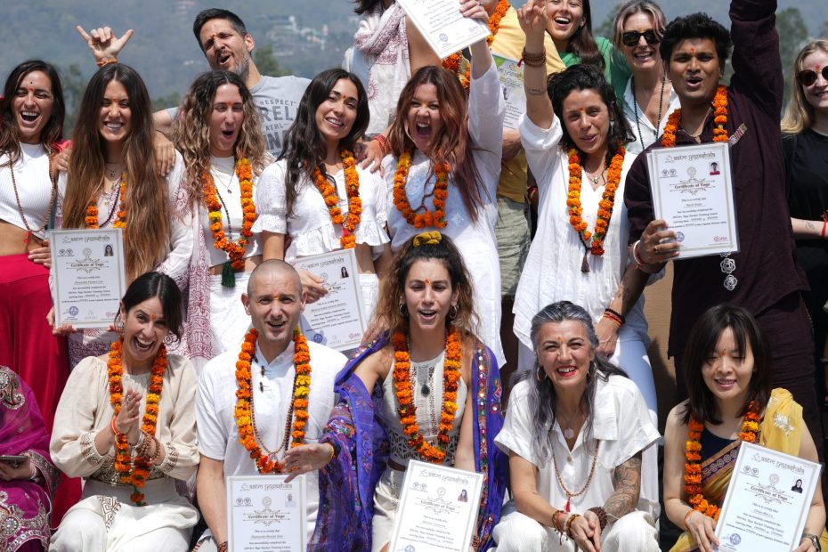 Group celebration with certificates outdoors.